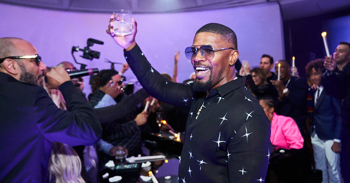 Actor Jamie Foxx celebrates with friends and family at an unknown event. 