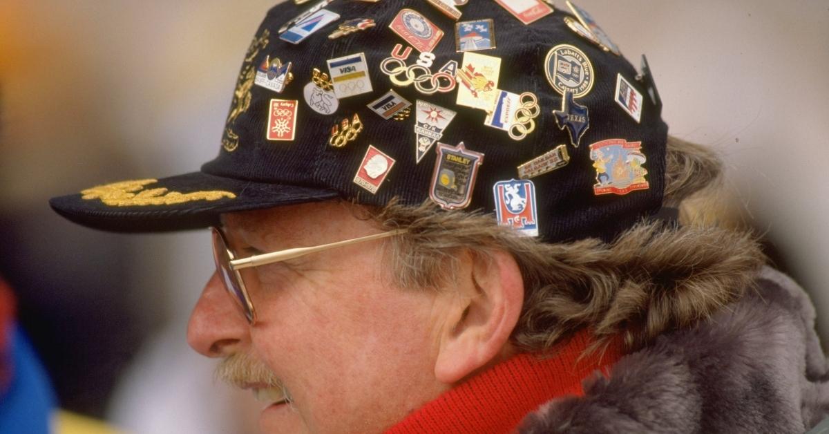 14 Feb 1988: A spectator wearing pins on his baseball cap watches the final of the 70 Metres Ski Jumping event during the 1988 Winter Olympic Games in Calgary, Canada. Mandatory Credit: Gray Mortimore/Allsport