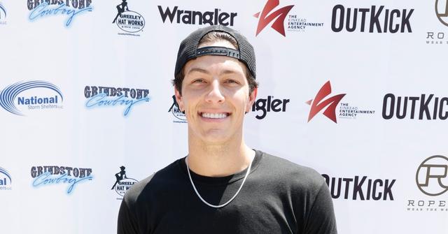 tayler holder black shirt and hat