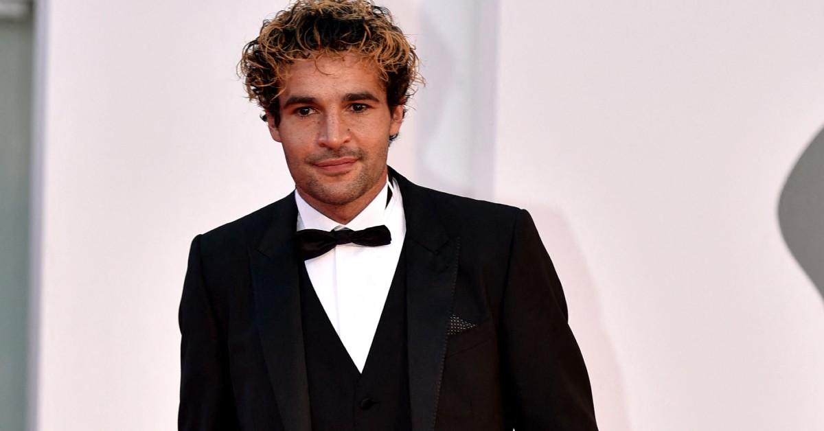 Christopher Abbott standing on the red carpet of a premiere