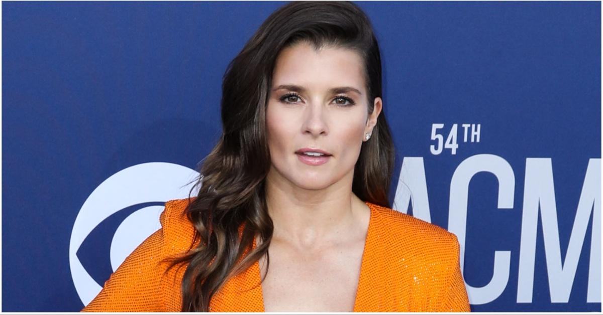 Danica Patrick posing for a press photo at an event