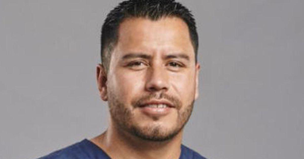 Hector Martinez in blue scrubs.