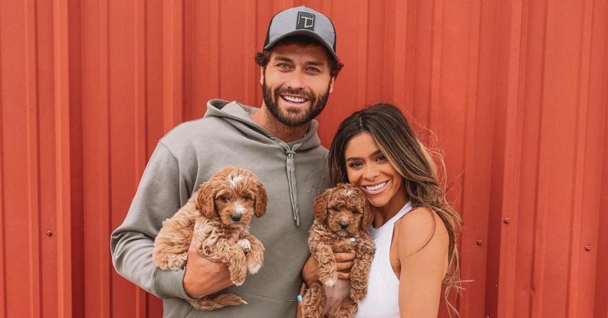 Taylor Frankie Paul with boyfriend Dakota Mortensen holding puppies in 2023