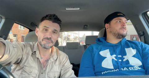 Jake and Tanner sitting in a car next to each other.