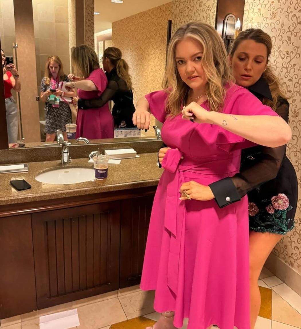 Blake Lively helping her friend Colleen Hoover with her dress.