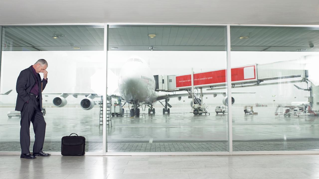 A man is frustrated at an airport