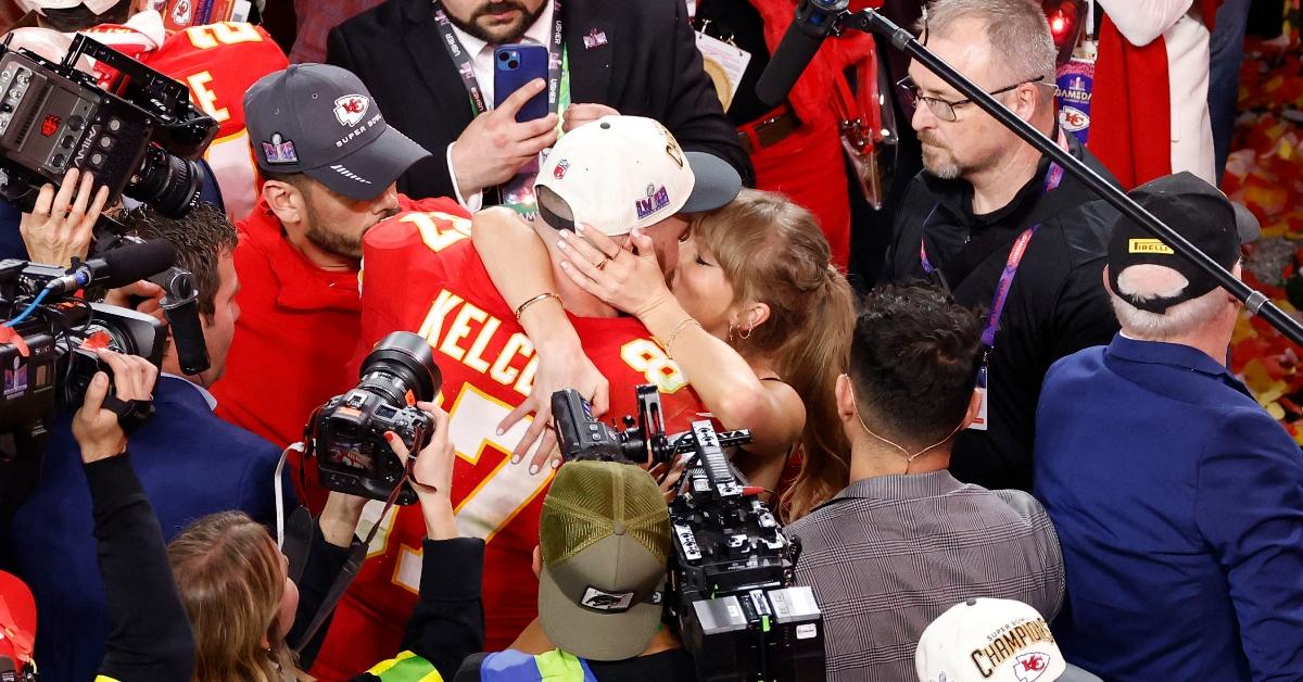 Travis Kelce and Taylor Swift kiss after he wins Super Bowl LVIII in February 2024