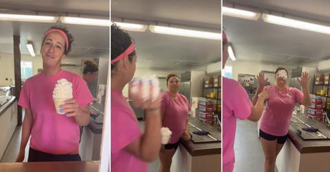 An employee throws whipped cream at another employee during the TikTok ice cream challenge