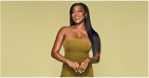 Jasmine Ellis Cooper in green-yellow dress