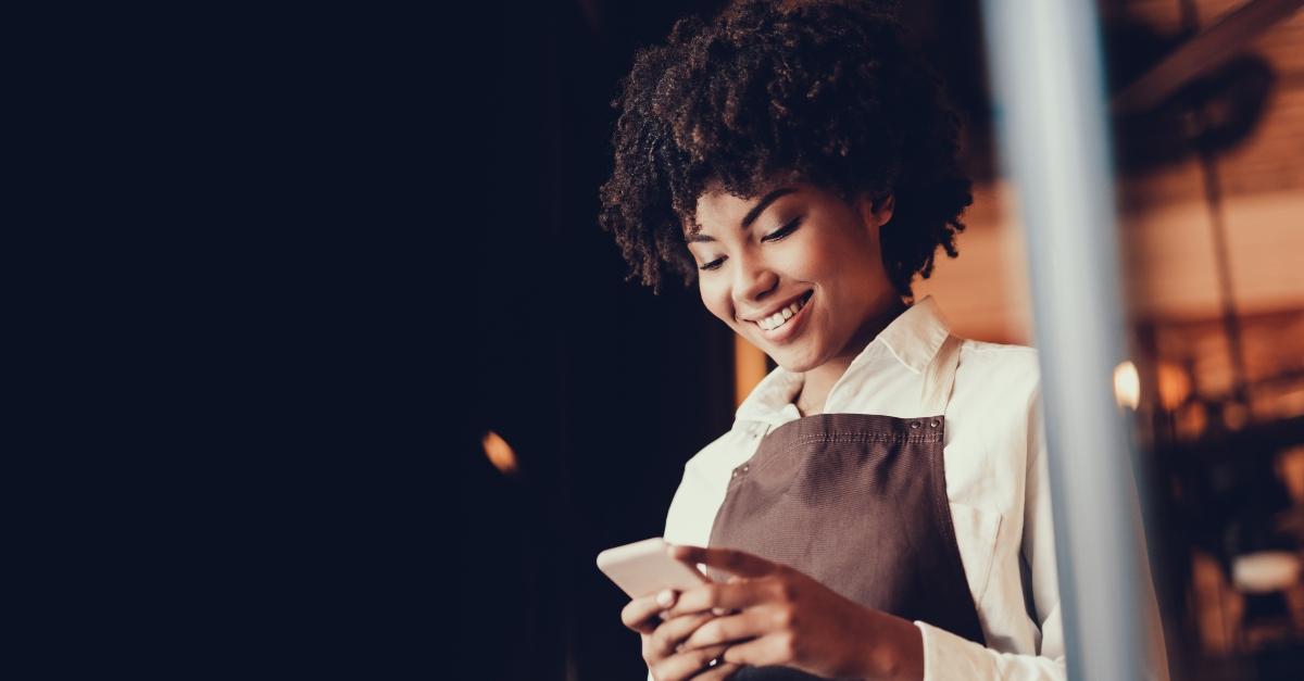 A waitress playing on her phone at work and milking the clock