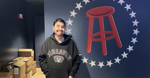 Mantis standing next to the barstool logo.
