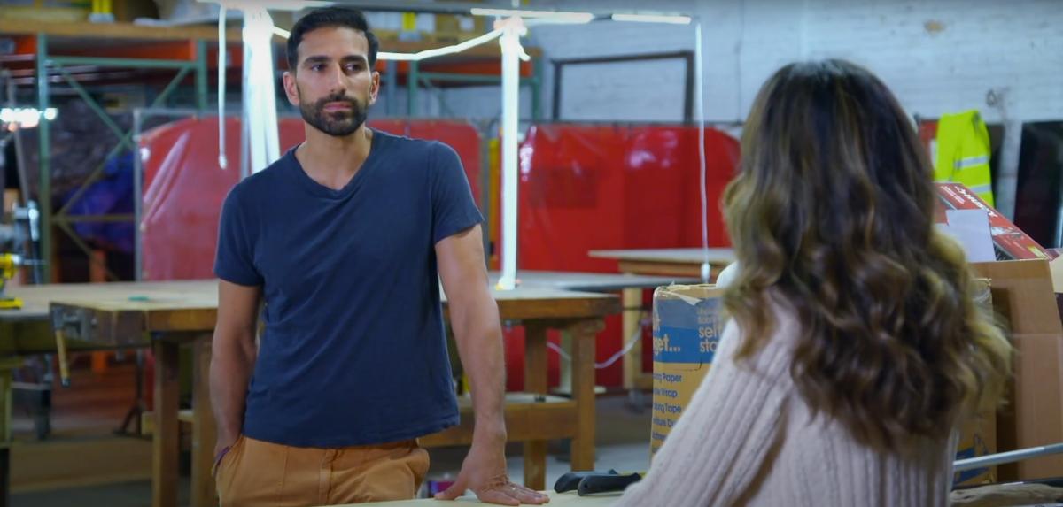 Juan talks with Karla in a machine shop on MAFS