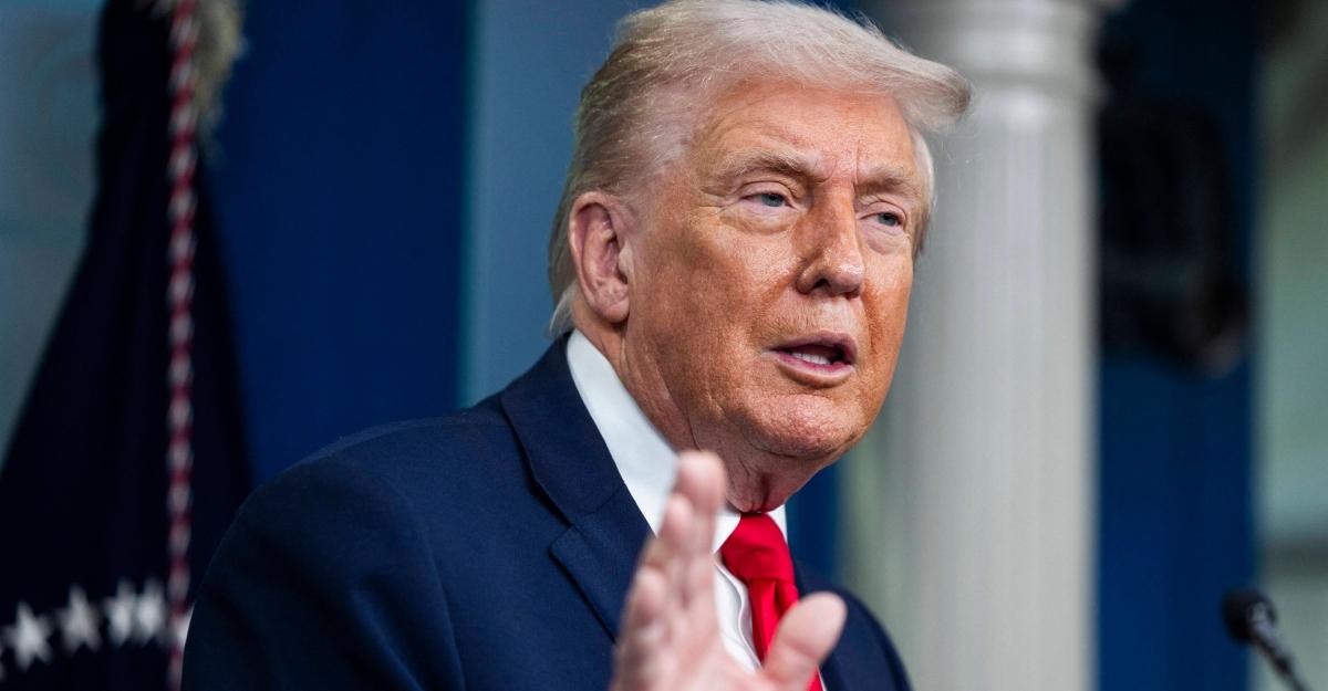 Trump speaks to reporters before going to Davos in January 2026.