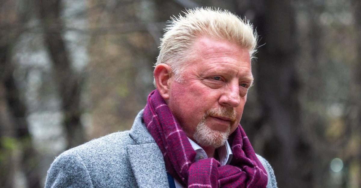 Boris Becker wearing a scarf and peacoat, arriving for his bankruptcy trial in 2022.
