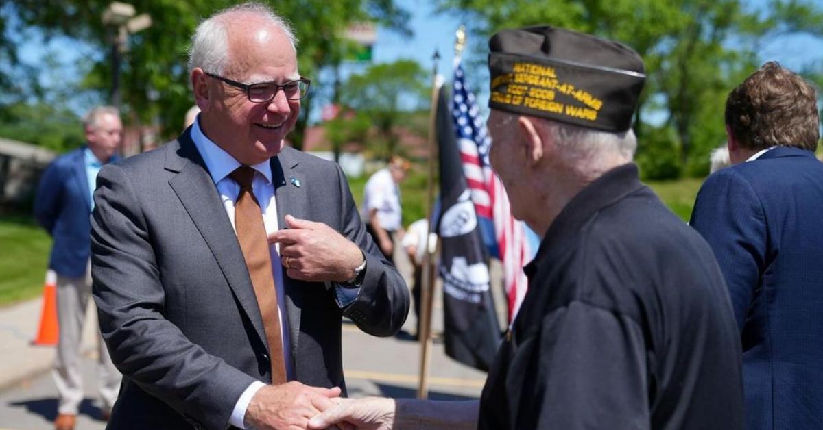 Tim Walz speaks to a veteran at the the opening of the St. Cloud Veterans Center Outstation in June 2024