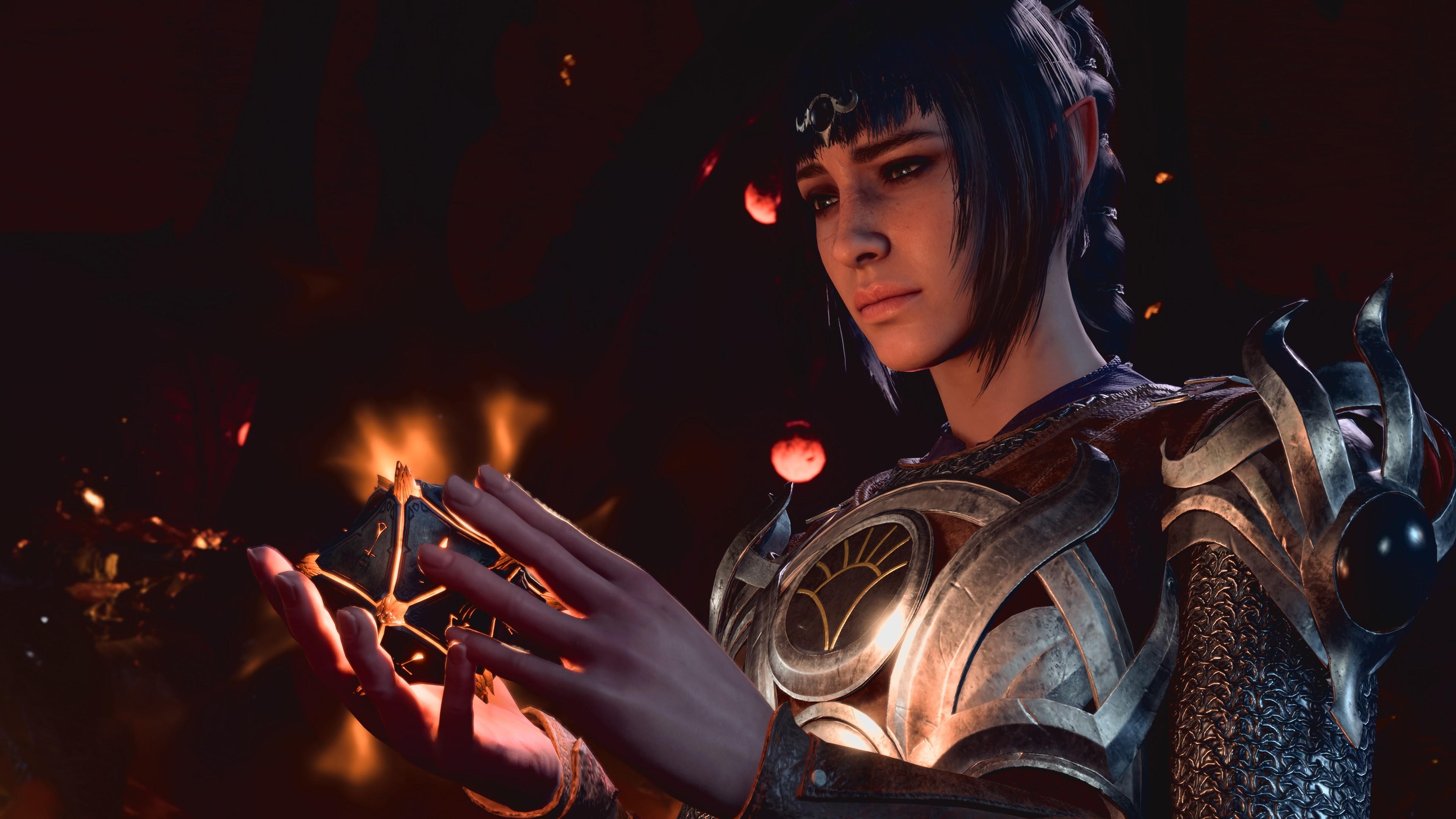 'Baldur's Gate 3' Close-up of Shadowheart holding a glowing artifact.