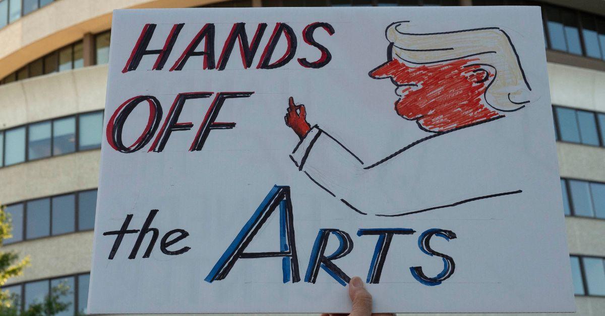 A "Hands off the arts" sign at a protest outside the Kennedy Center. 