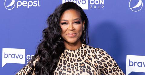 Kenya Moore in cheetah print on the red carpet.