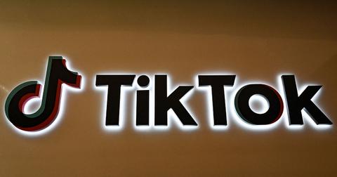 A TikTok logo on a wall