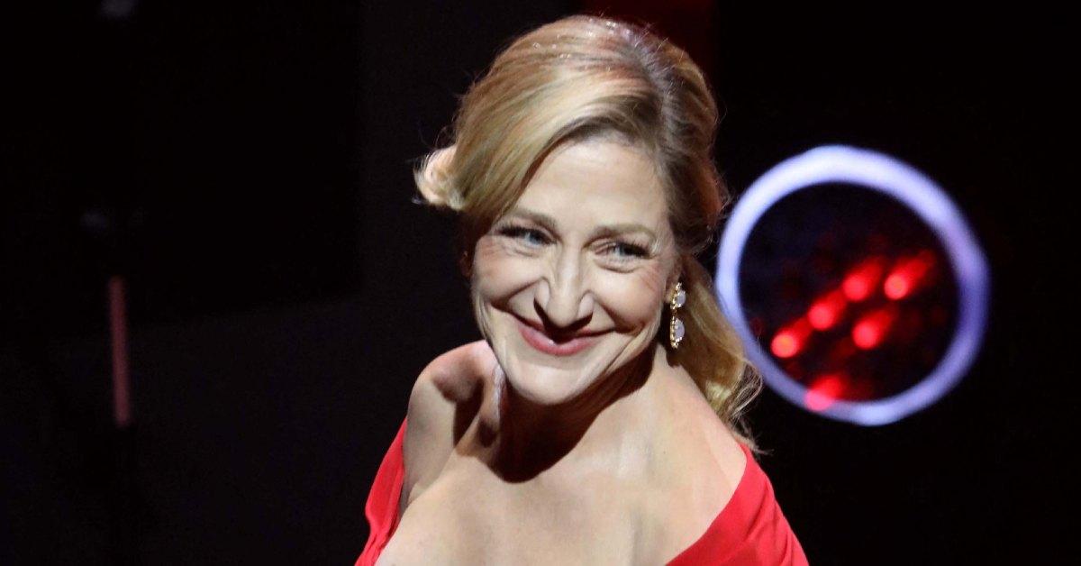 Edie Falco wearing a red dress.