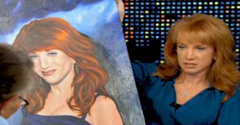 Kathy Griffin holds a painting of herself done by Erik Menendez