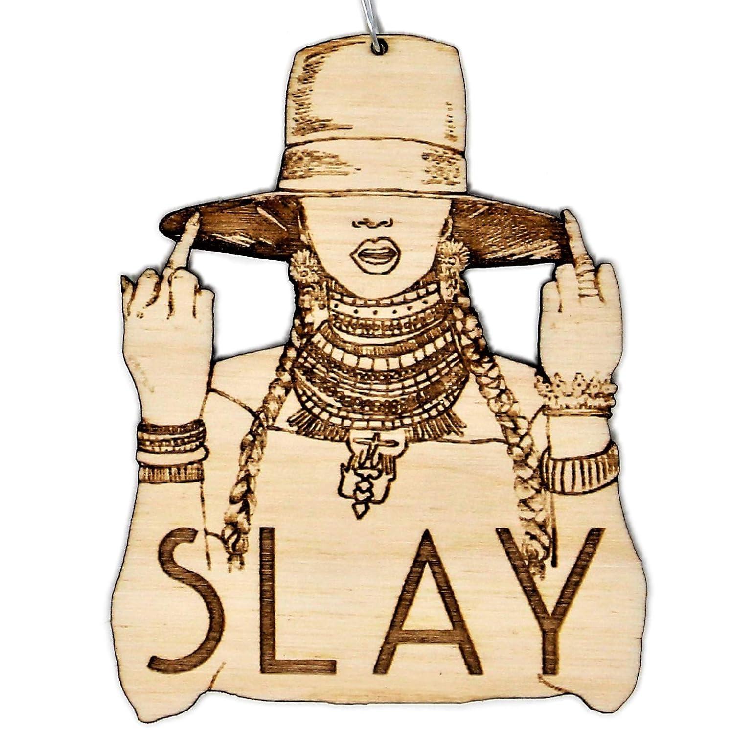 A ornament of a silhouette of Beyonce with the word "Slay"