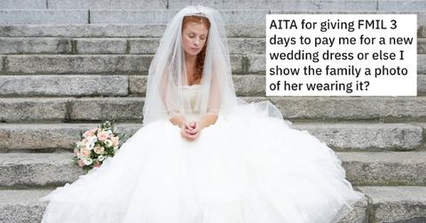 A woman in a wedding dress looking solemn