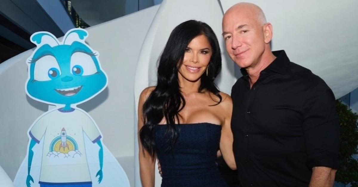 Lauren Sanchez and Jeff Bezos stand in front of a staircase