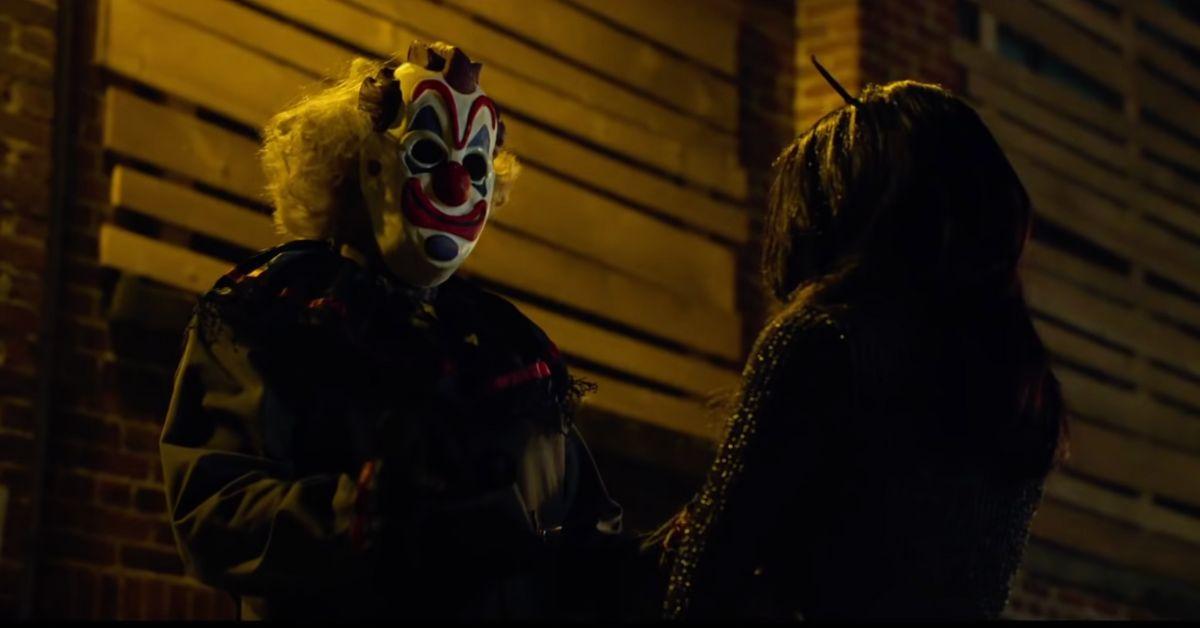 person wearing clown mask in 'haunt'