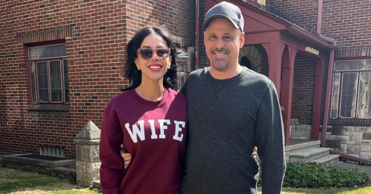 Jasmine wearing a "wife" sweatshirt alongside Gino.