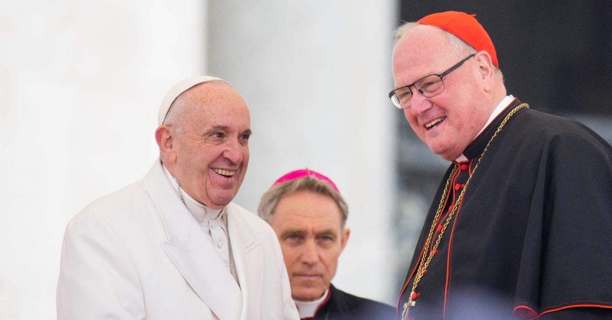 Late Pope Francis (L) and Cardinal Timothy Dolan (R)