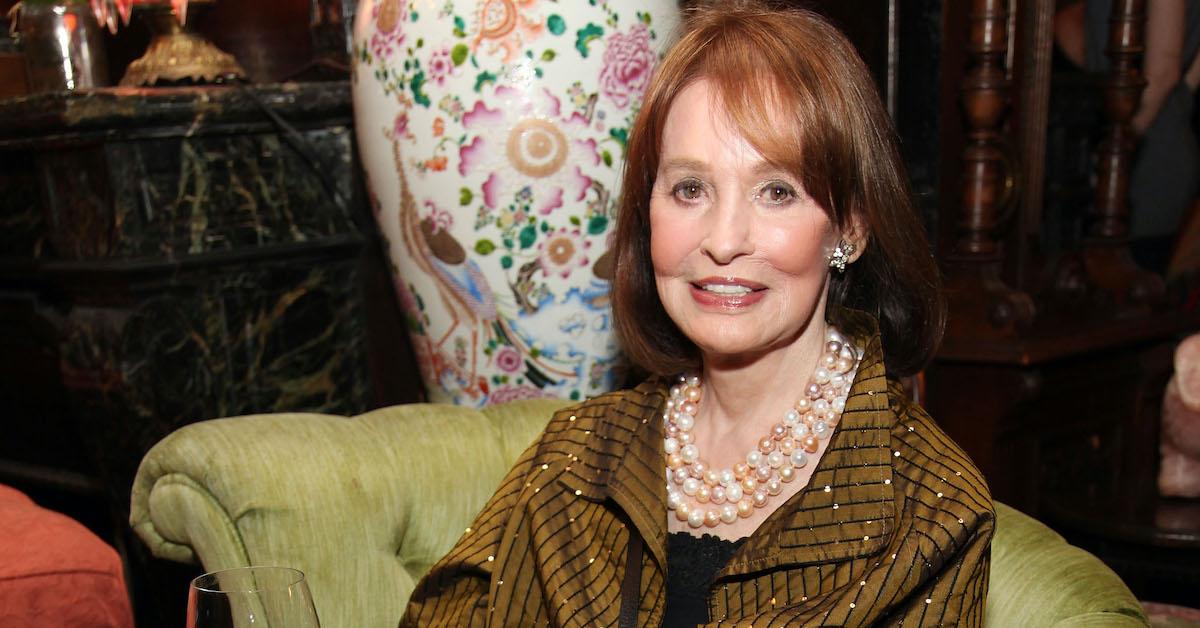 Gloria Vanderbilt wearing pearls and and a striped top.