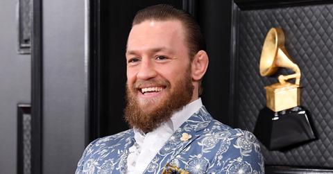 Conor McGregor in a blue and white suit.