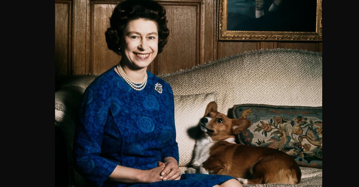 Queen Elizabeth II poses with one of her beloved corgis at Sandringham in 1970