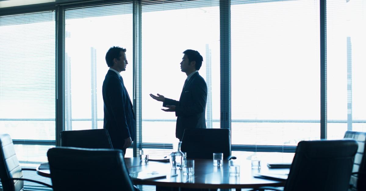 men talking in conference room