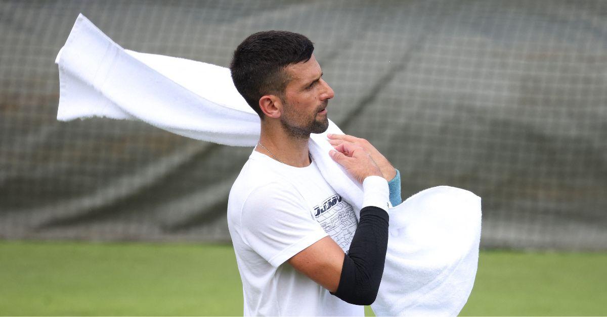 Novak Djokovic holding a towel at Wimbledon in 2024. 