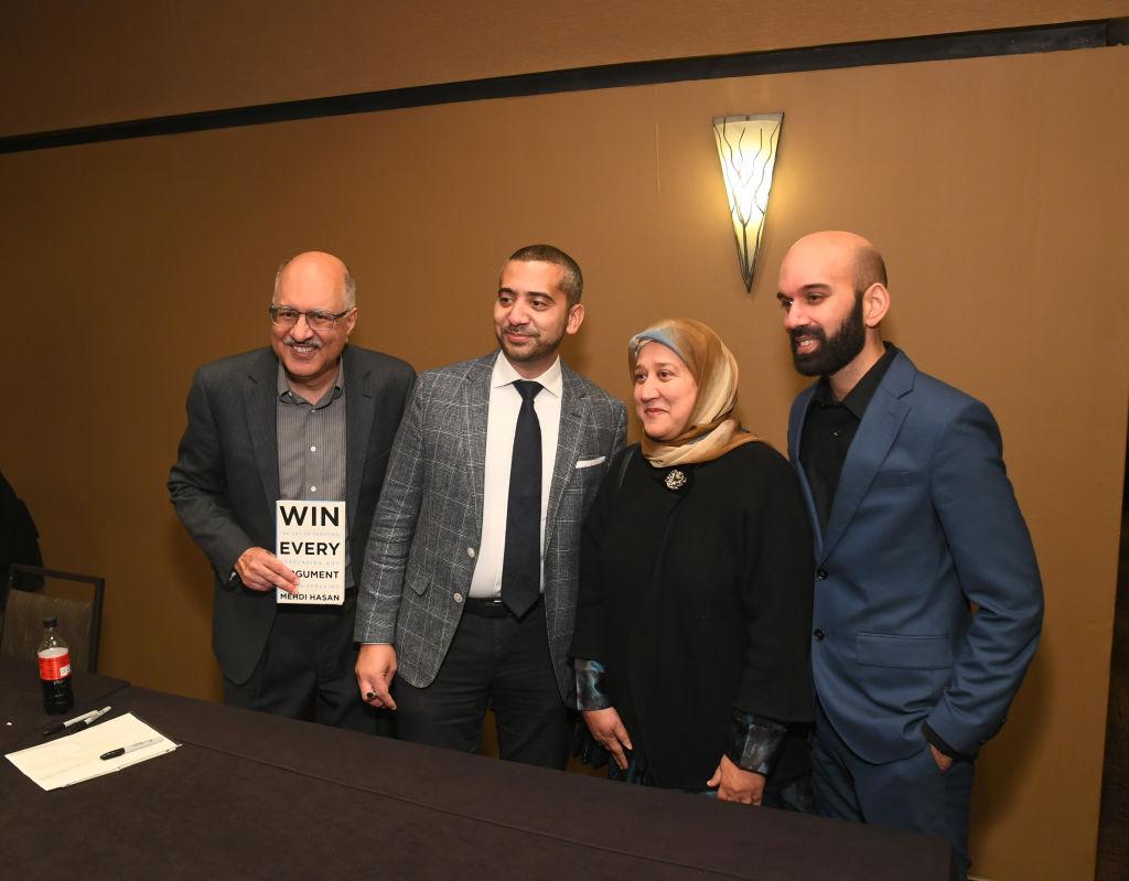 Mehdi Hasan at the Muslim Conference with his book