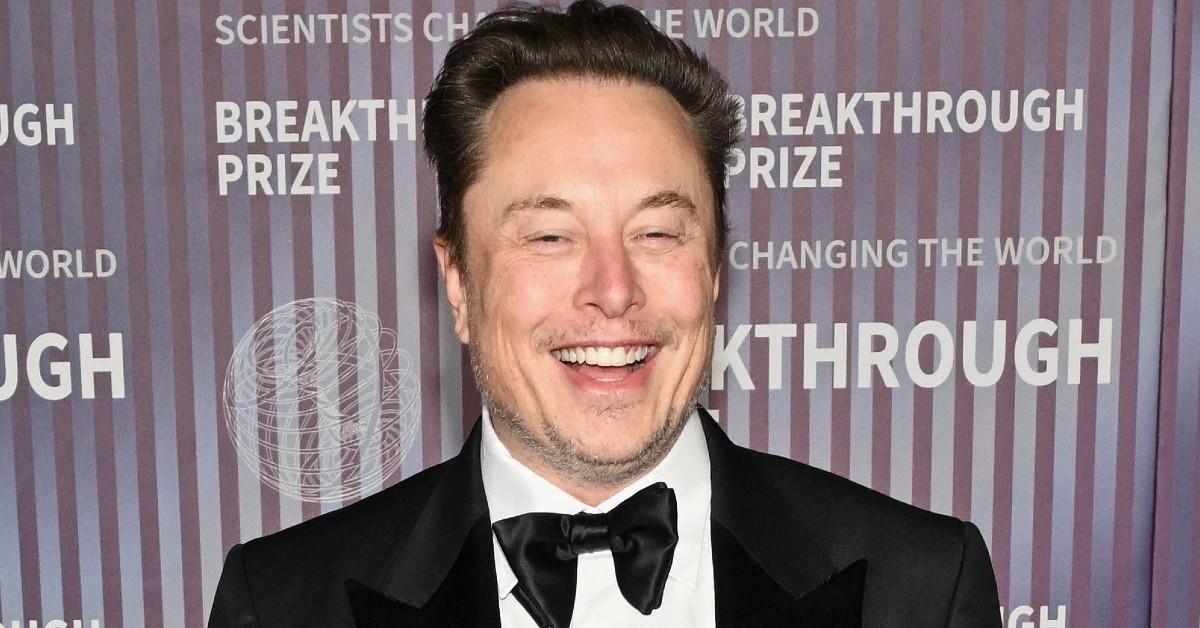 Elon Musk smiling with closed eyes