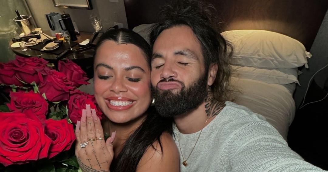 Drew Afualo and Pili Tanuvasa showing off the engagement ring