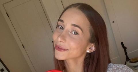 Indy Blue taking a selfie with earrings on.