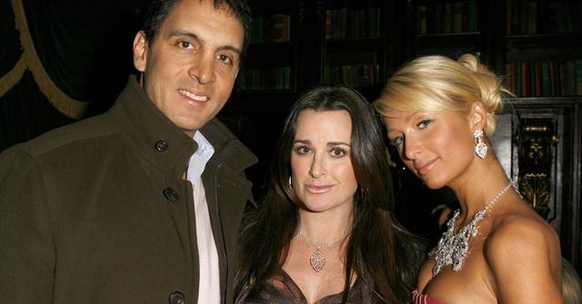 Mauricio Umansky, Kyle Richards, and Paris Hilton pose for photo in 2012