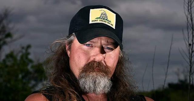 Dusty Crum wearing a black hat