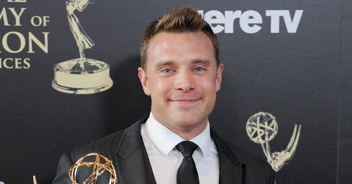 Billy Miller holding his Emmy at the Daytime Emmy Awards in 2014