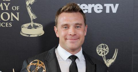 Billy Miller holding his Emmy at the Daytime Emmy Awards in 2014