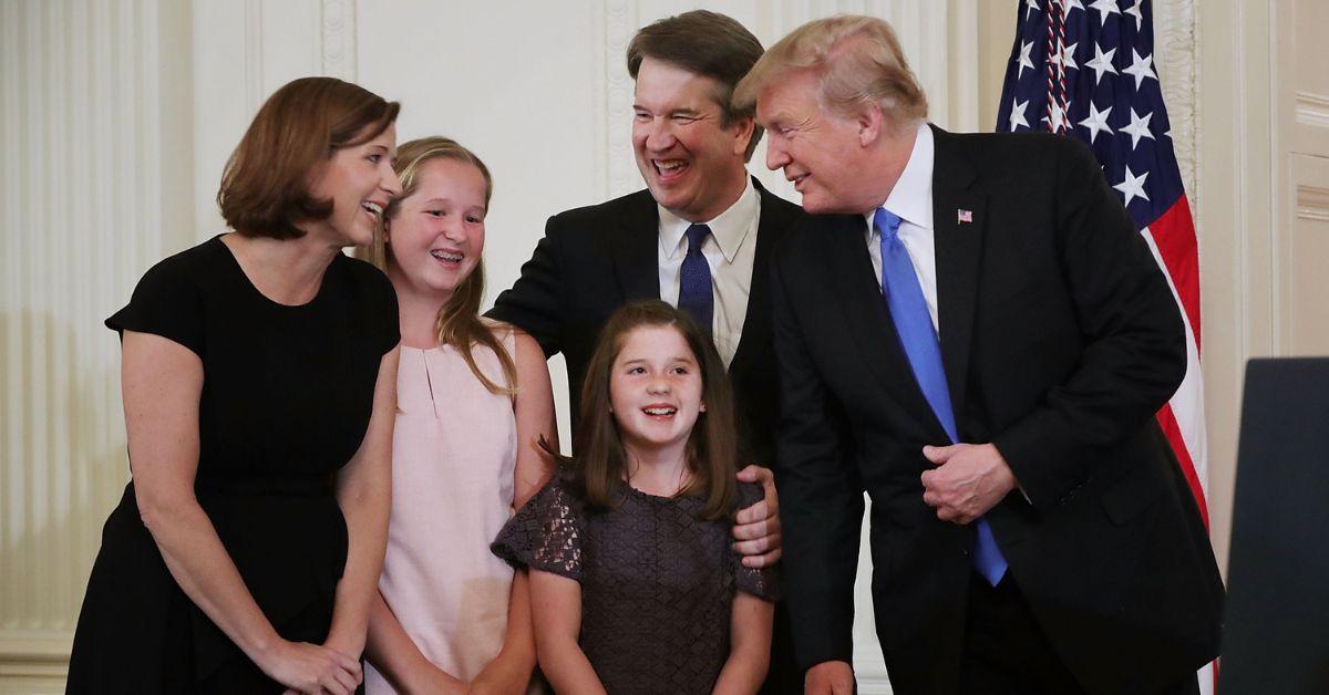 Ashley Kavanaugh, Margaret Kavanaugh, Brett Kavanaugh, Liza Kavanaugh, and Donald Trump smiling in 2018.