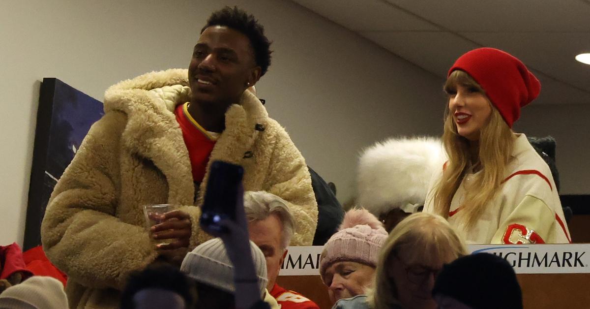 Jerrod Carmichael and Taylor Swift attend a Kansas City Chiefs football game in January 2024.