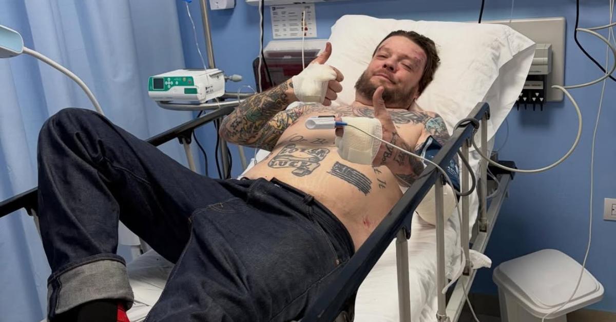 Corey Harrison in a hospital bed following his motorcycle accident.
