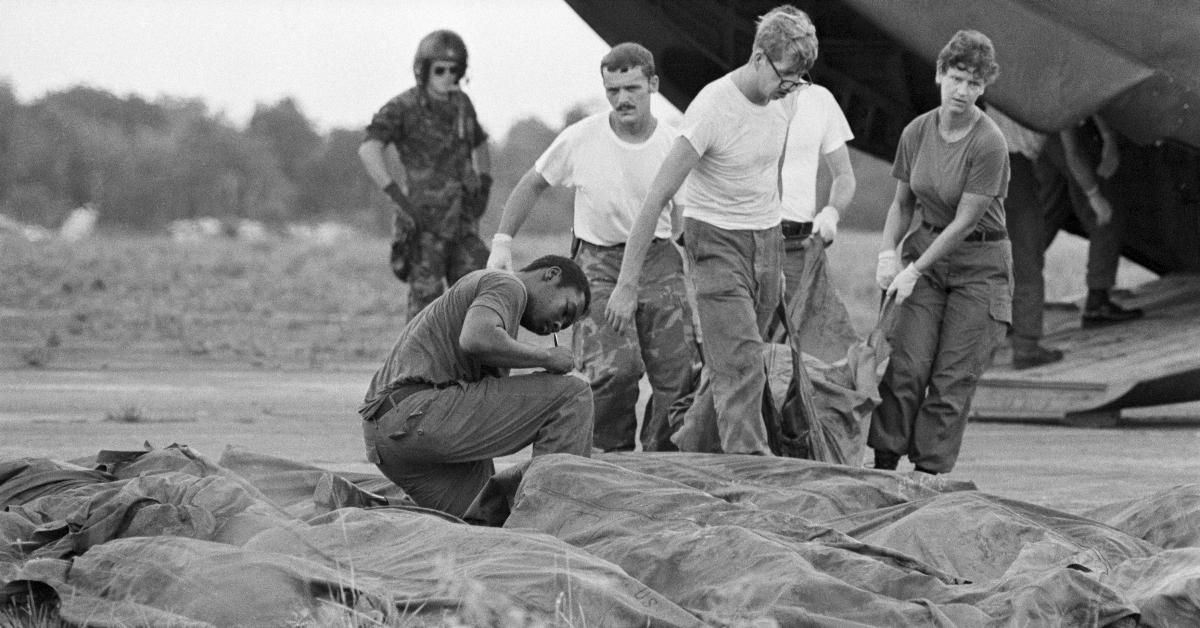 A U.S. military body recovery unit removes more victims of the Jonestown mass suicide-murder from a helicopter at Georgetown's International Airport