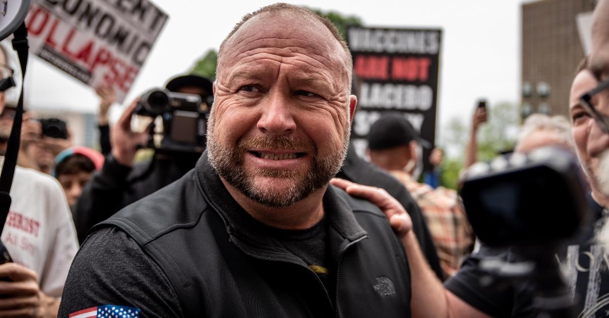 Alex Jones interacts with supporters at the Texas State Capital building on April 18, 2020