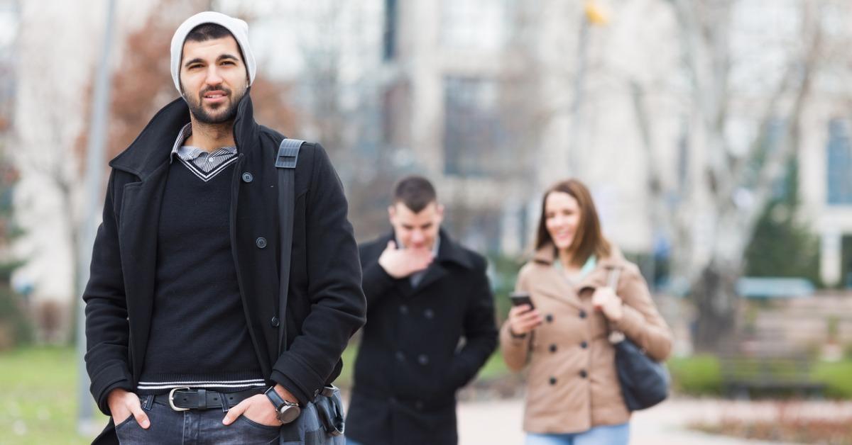 group of young people is walking down the city street picture id